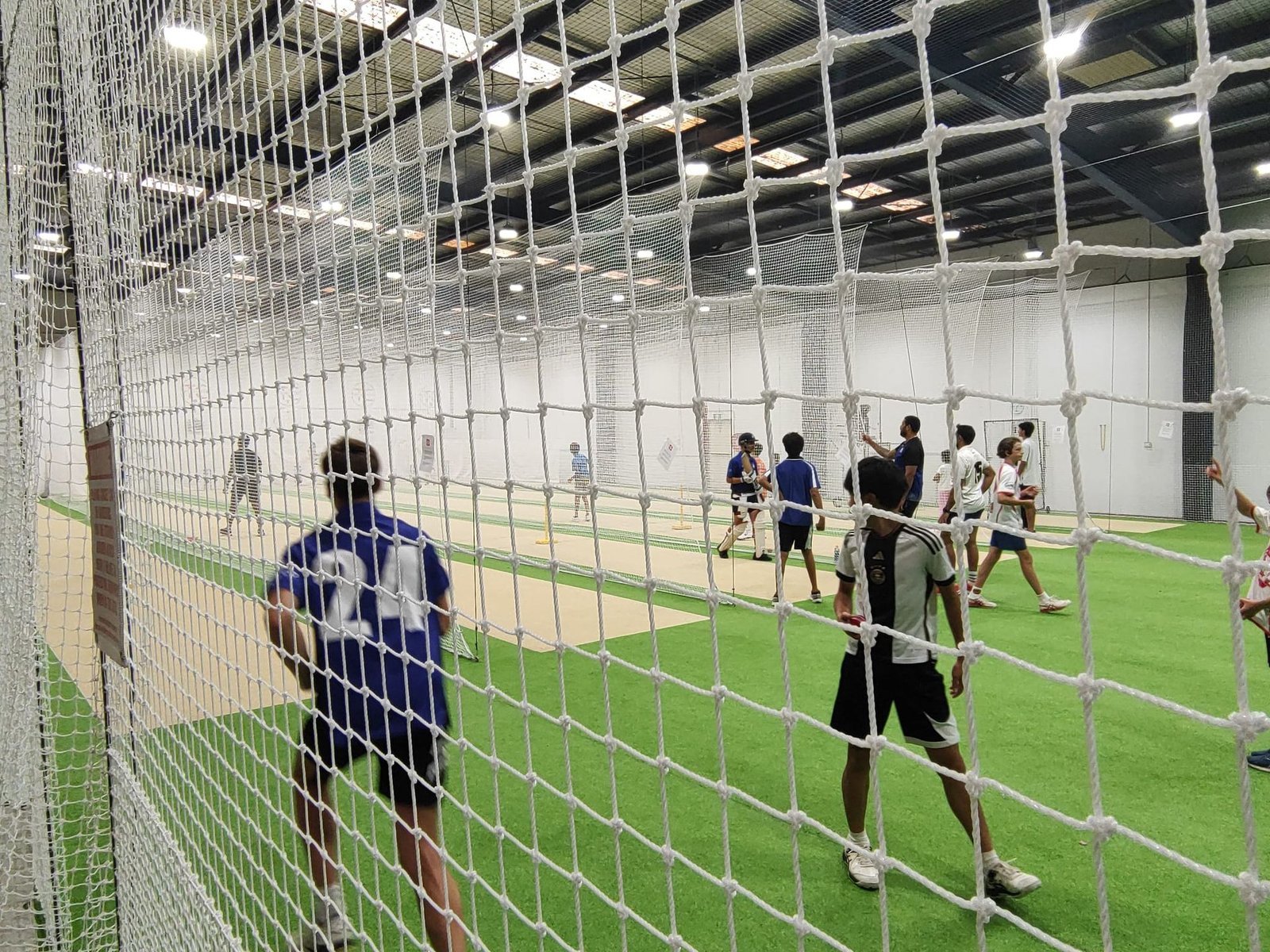 Players training together at the indoor cricket centre
