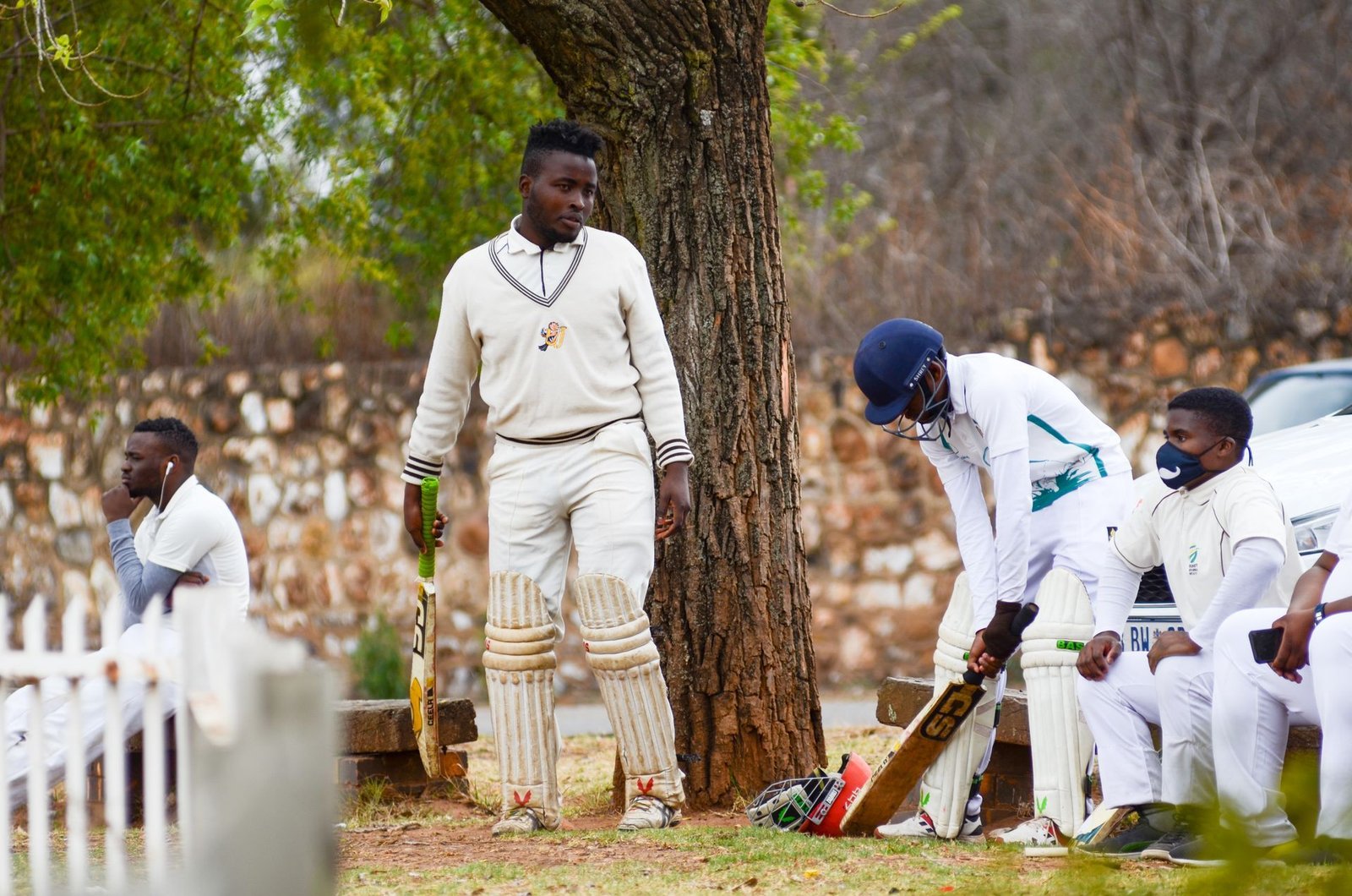 Cricket players gathered together as a team
