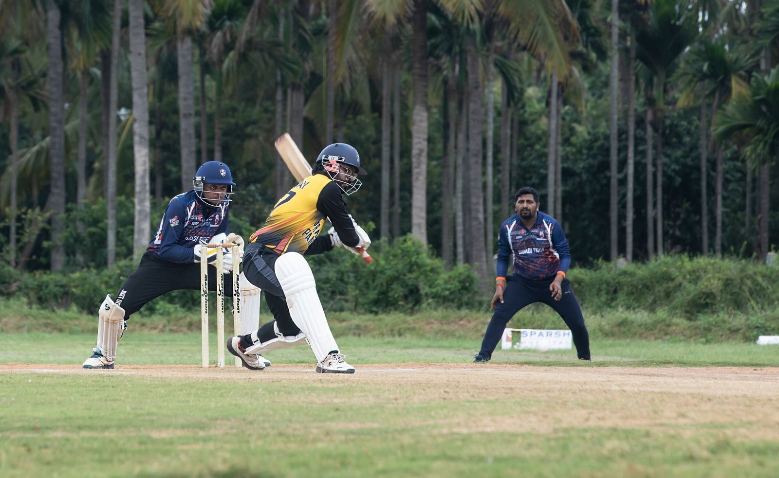 Live match-play action with fielders in position