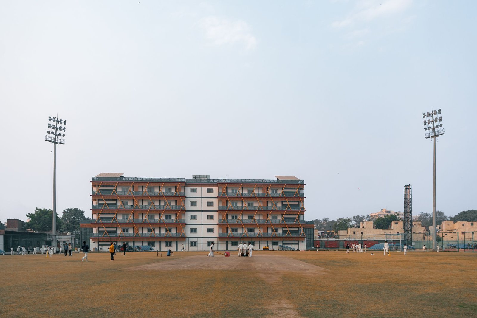 Well-maintained cricket ground under lights
